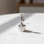 Tinnen asbeeld moeder en kind niet te verbreken band